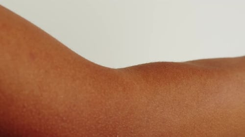 Close Up of Bare Arm Against White Background