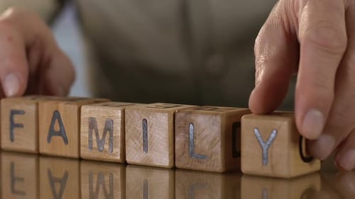 Family Old Man Making Word of Wooden Cubes
