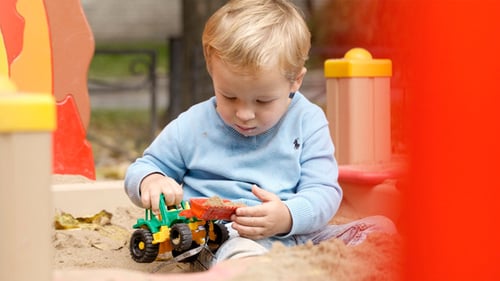 Boy Playing With Toy on Playground