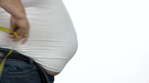 Adult Measures Large Waist With Tape Measure