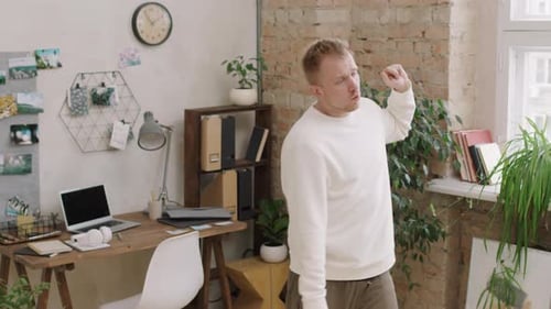 Man Dancing Joyfully in Sunny Room