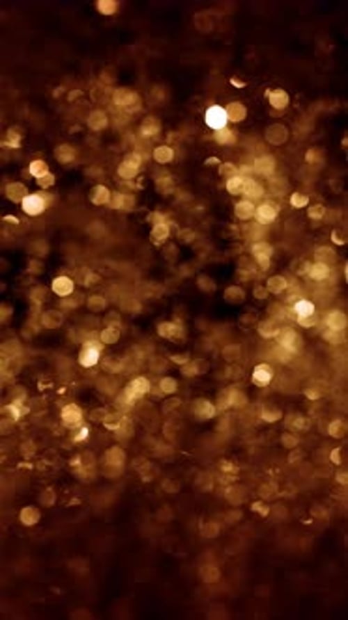 Abstract Vertical Golden Bokeh Texture Loop with Defocused Lights