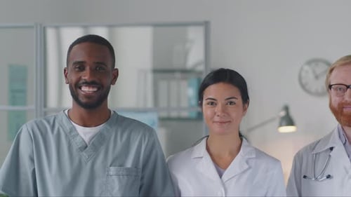 Portrait of Team of Cheerful Multiethnic Doctors in Medical Office