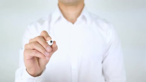 Man Writes the Word Balance on Transparent Surface
