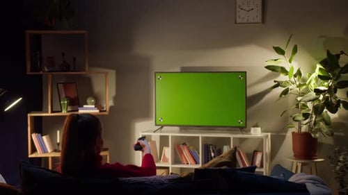 Woman Watching Television with Chroma Green Screen