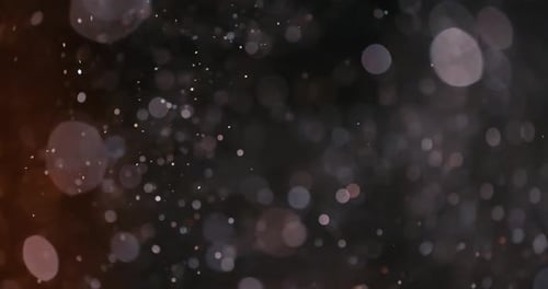 Abstract Particles Floating in Dark Background