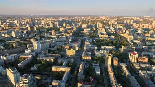 City Center at Dawn. Aerial Flight Over the Morning City. Early Morning Sunrise. Golden Hour. Glory