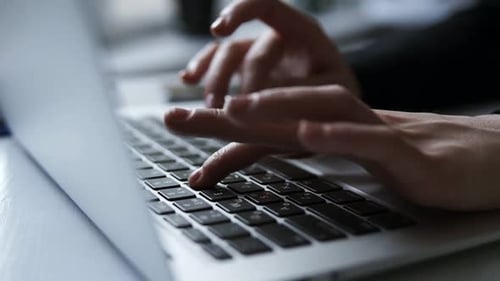 Unrecognizable Female Hands Typing Something on Laptop Keyboard