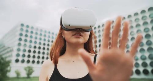 A woman using augmented reality glasses in the city