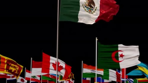 Waving Mexican Flag and Blurred International Flags