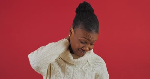 Woman Rubbing Her Neck in Pain