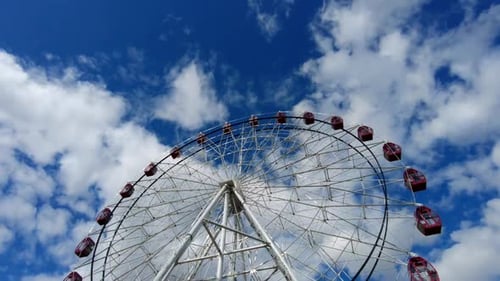 Ferris Wheel Under Blue Sky With Clouds