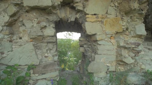 Stone wall with an access hole