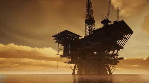 Offshore Jack Up Rig in The Middle of The Sea at Sunset Time