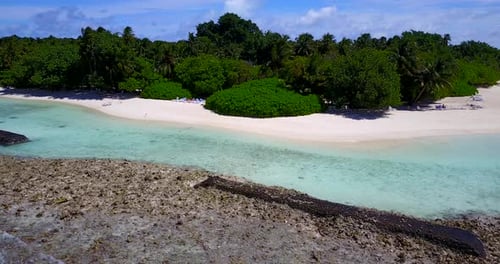 Daytime birds eye abstract shot of a paradise sunny white sand beach and aqua turquoise water background