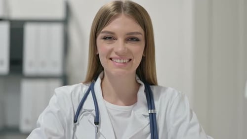Smiling Female Doctor Portrait in Clinic Office