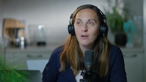 Woman Speaks into Microphone for Podcast Broadcast
