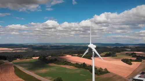 Wind generator with huge rotating blades in field