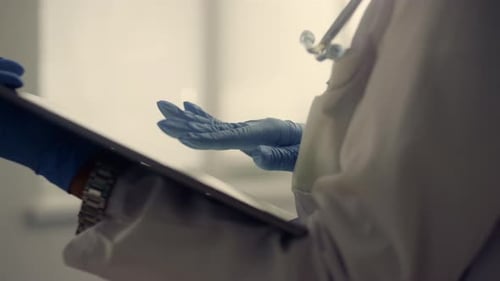 Doctor Hands Touching Tablet Screen Close Up