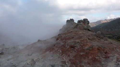 Iceland. Geothermal field with fumaroles and geysers. Natural steam vents. Smoking fumaroles.