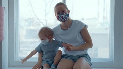 Woman and Child Together Wearing Protective Masks