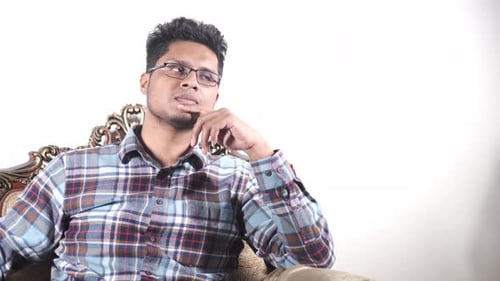 Man Sits Thinking and Has an Idea