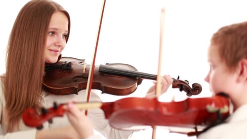 Woman and Child Play Violins Together