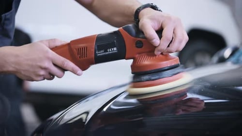 Close Up Polishing Machine Buffing Black Car