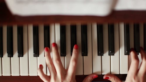 Piano Keyboard Being Played Indoors