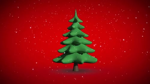 Snow falling on revolving fir tree