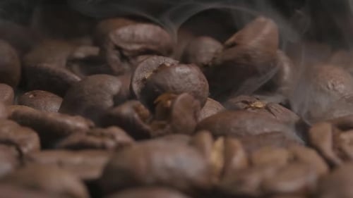 Steaming Roasted Brown Coffee Beans Close Up
