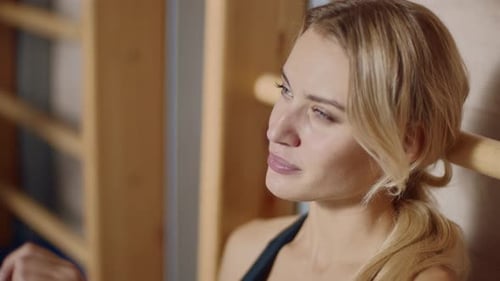 Blonde Woman Drinking Water After Workout