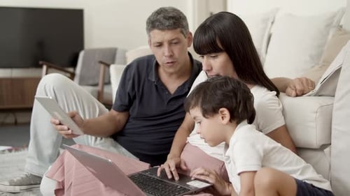 Family Relaxing at Home with Technology