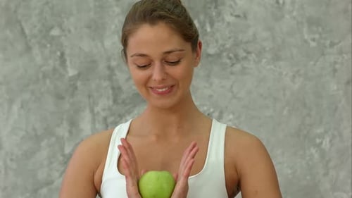Carefree Healthy Hispanic Woman Holding Green Apple Smiling