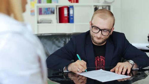 Young Businessmen Sign A Contract.