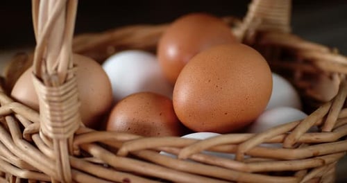 The Basket with Fresh Raw Eggs Rotates Slowly.