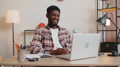 African American Making Conference Calling By Webcam Focused Student Study Online at Home Office