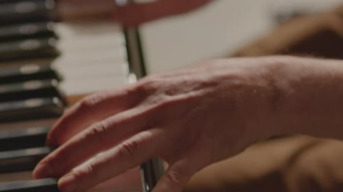 Hands Playing Piano Keyboard Close Up