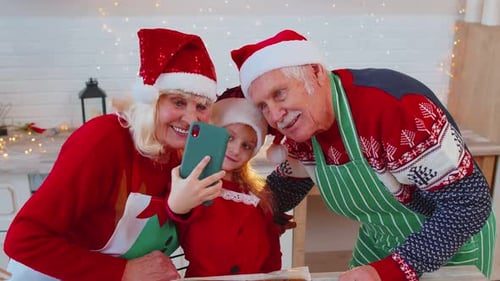Family Celebrates Christmas with a Selfie in Kitchen