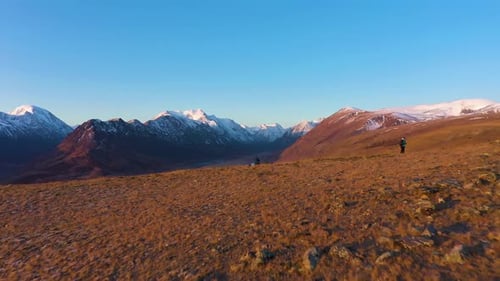 Photographers and Beltirdu Mountain Ridge. Aerial View. The Altai Mountains
