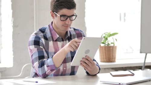 Young Man Using Tablet