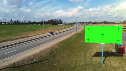 Aerial footage billboard poster with green screen and tracking markers.