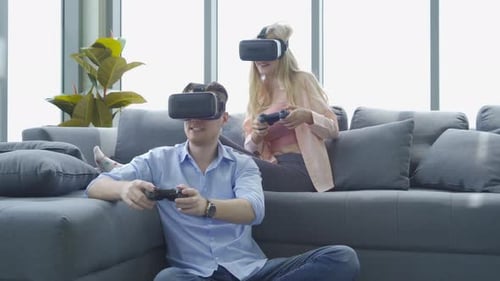 Couple Playing Video Games with VR Headsets