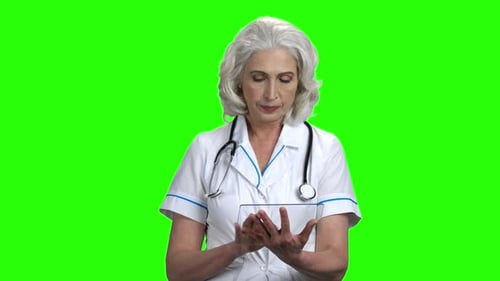 Doctor Using Transparent Touchscreen on Green Screen