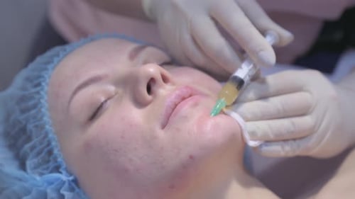 Woman on the Procedure of Mesotherapy Injection