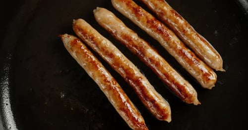 Delicious Fried Sausage in a Frying Pan