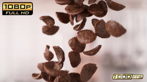 Chocolate corn flakes cereal falling in slow motion