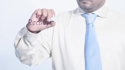 Man Writes Recession on Clear Surface