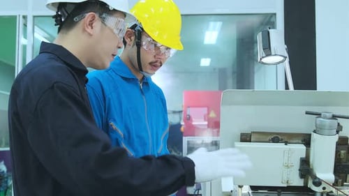 Professional engineering walking discuss inspecting with engineer team machinery factory area.