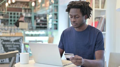 Successful Online Payment on Laptop By African Man